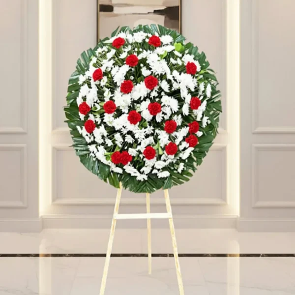 Corona de flores para difuntos en diseño elegante con entrega a domicilio en CDMX.