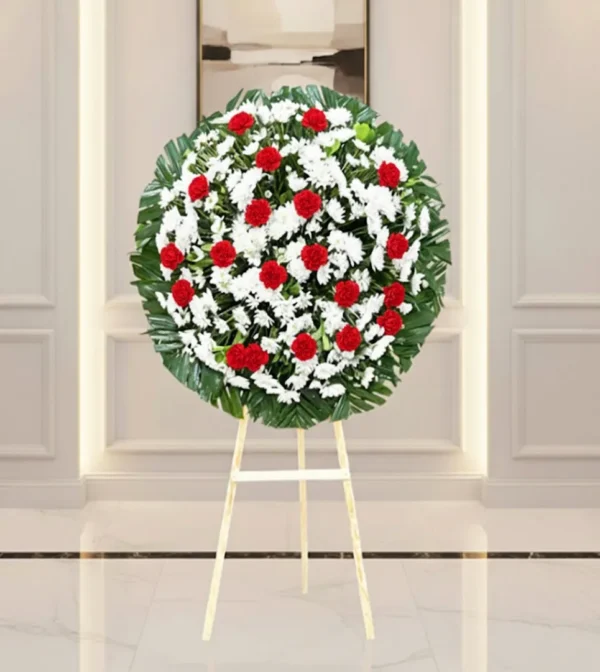 Corona de flores para difuntos en diseño elegante con entrega a domicilio en CDMX.
