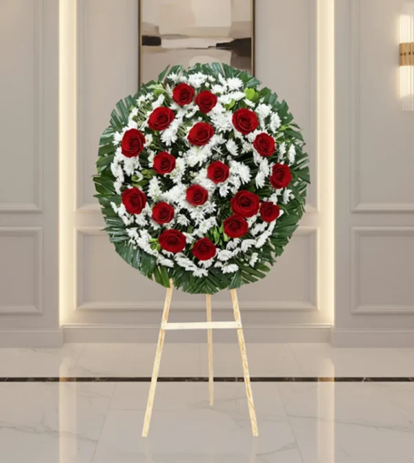 Corona para difuntos con flores frescas en diseño fúnebre elegante