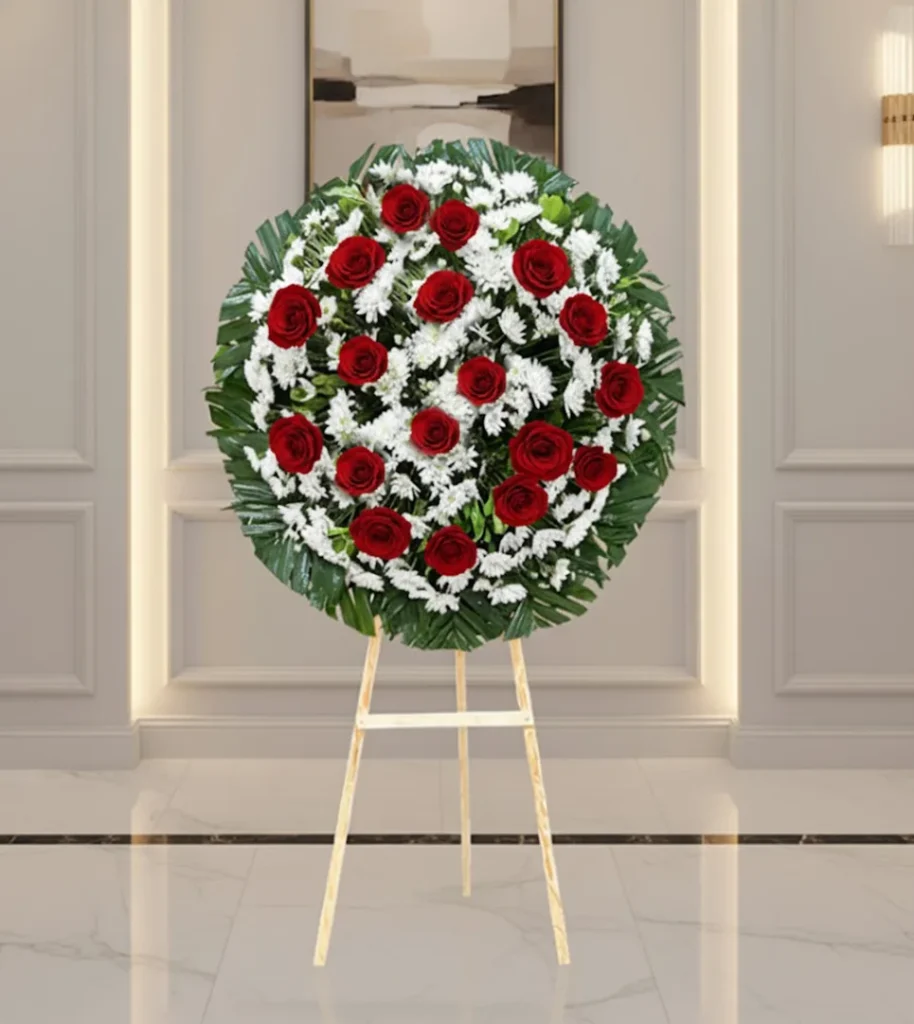 Corona para difuntos con flores frescas en diseño fúnebre elegante